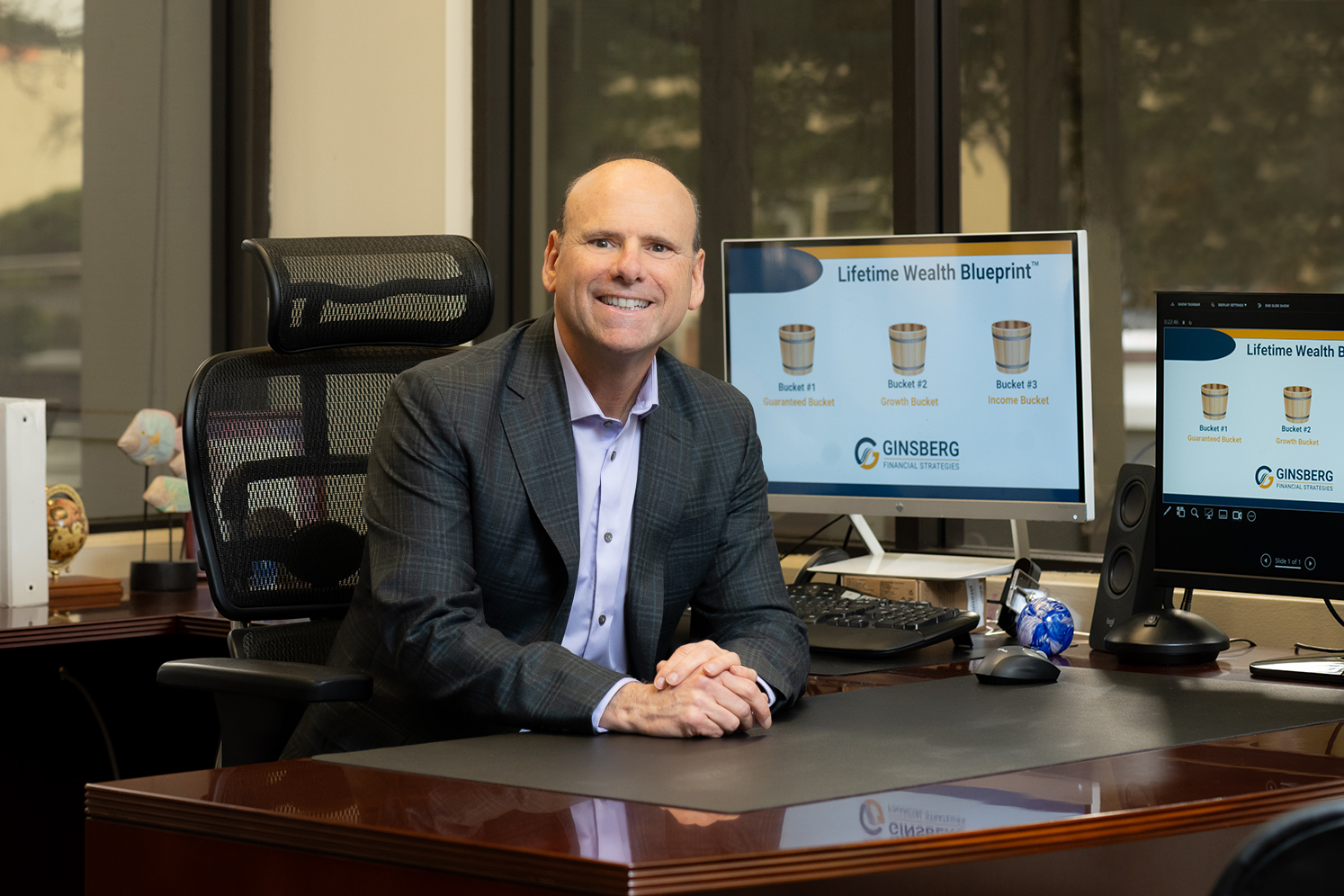 Michael Ginsberg JD CFP founder of Ginsberg Financial Strategies in office setting