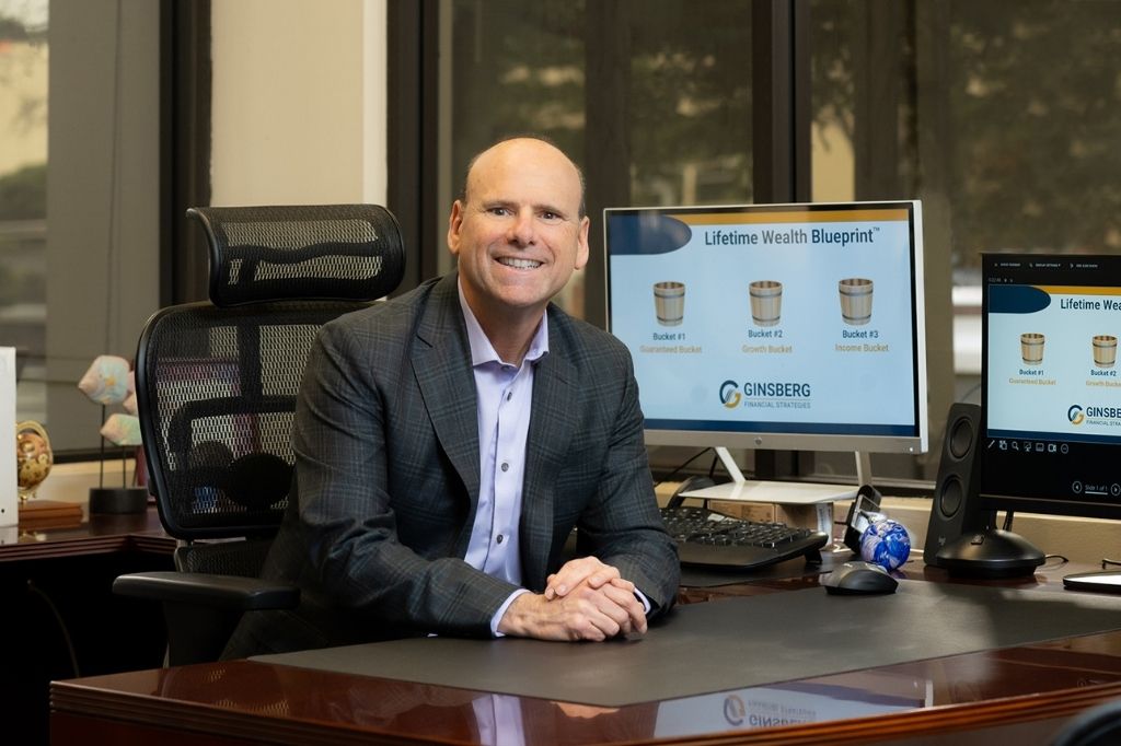 Michael Ginsberg of Ginsberg Financial Strategies showcasing the Lifetime Wealth Blueprint™ with visual representation of the Guaranteed, Growth, and Income Buckets. Michael Ginsberg of Ginsberg Financial Strategies showcasing the Lifetime Wealth Blueprint™ with visual representation of the Guaranteed, Growth, and Income Buckets.