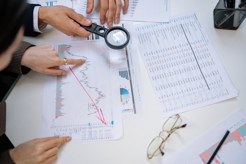 Retirement needs assessment with a magnifying glass over a financial document - retirement income planning The Retirement Income Roadmap: Navigating Your Path to a Secure Future 2
